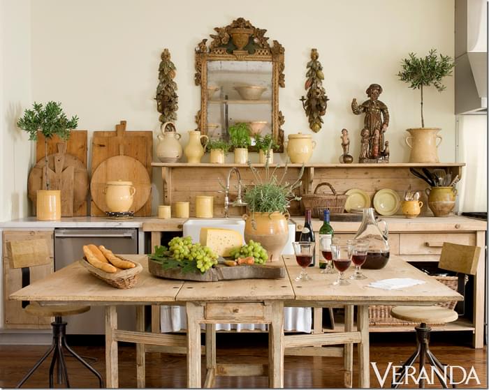 One of the most interesting rooms in Jane's house is the kitchen. Part of the kitchen counter is a 19th century architect's desk. 19th Century Swedish table is from her own antique shop, Jane Moore Interiors. 