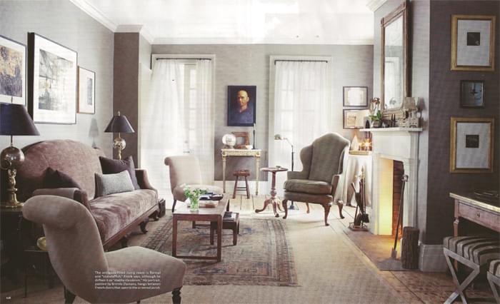 In the living room of a Hudson Valley town home, designer Peter Frank uses a small antique Oushak on top of seagrass. The rug alone would look too small in the room. This photo is from the October issue of House Beautiful.