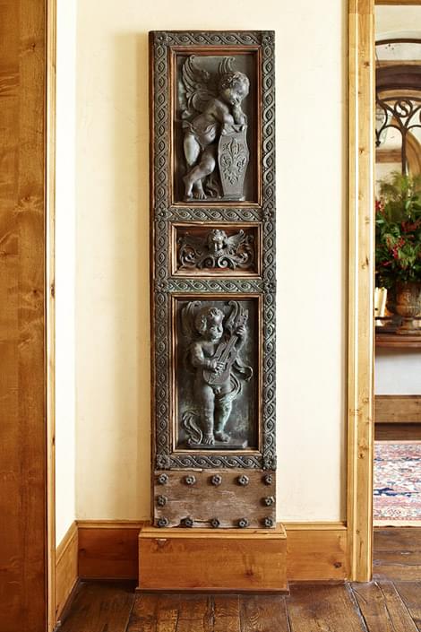 Eighteenth-century Venetian bronze doors flank the dining room archway. The antique doors are from Matt Camron as well.