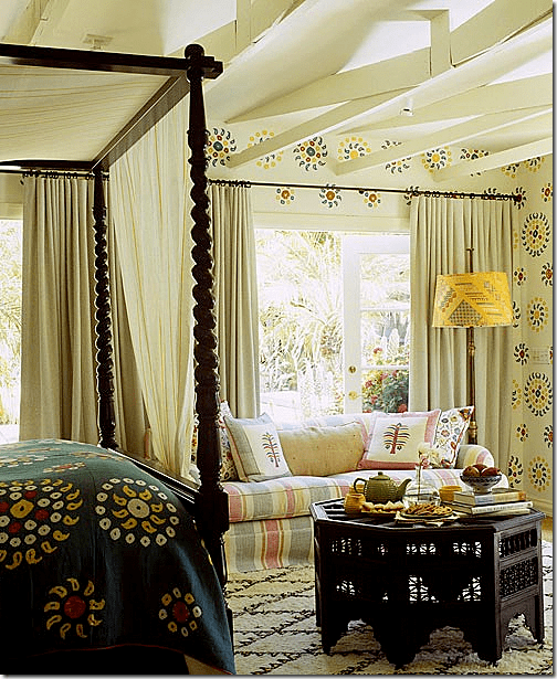 In Kathryn Ireland's ojai ranch house, she uses a Moroccan rug and table to create a colorful guest room. Image via Cote De Texas